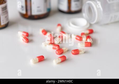 Medicine pills, drugs in different colours arranged on a white background. Human health care medical concept. Stock Photo