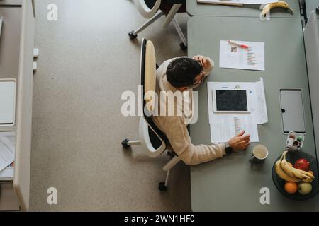 Successful business person working in an innovative indoor office. Stock Photo