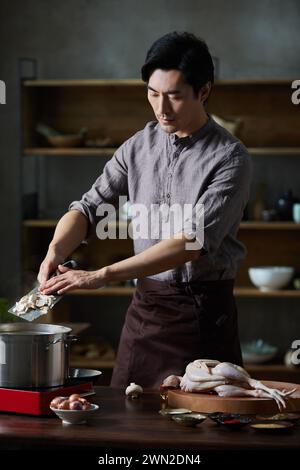 Cook making dishes in the kitchen Stock Photo