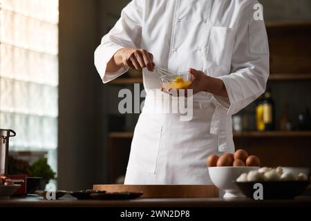 Cook making dishes in the kitchen Stock Photo