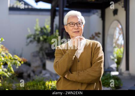 Senior Man in Classical Garden Stock Photo