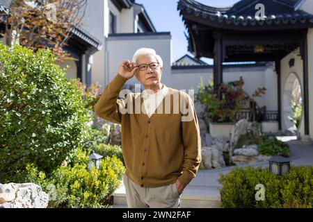 Senior Man in Classical Garden Stock Photo