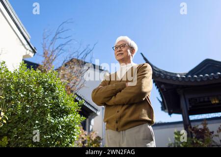 Senior Man in Classical Garden Stock Photo