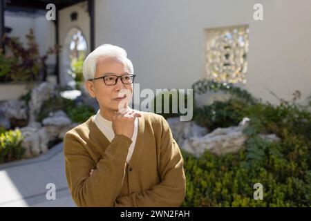 Senior Man in Classical Garden Stock Photo