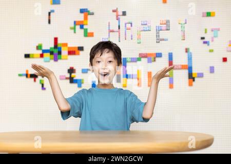 Cheerful girl sitting in classroom Stock Photo