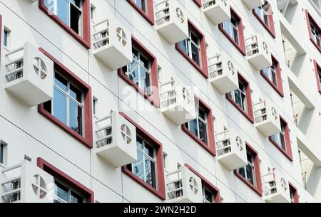 Apartment building wall with large group of air-conditioners, China Stock Photo
