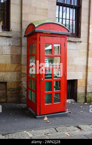 The old red telephone booth you mentioned is located on George Street in The Rocks area of Sydney, Australia1. This iconic booth is a nod to the Briti Stock Photo