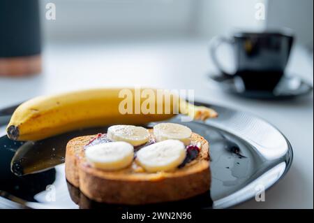 Well-balanced morning: A nutritious breakfast spread with a banana and whole-grain bread Stock Photo