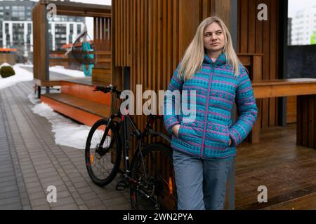 Nice young woman rented a bicycle Stock Photo