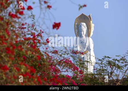 Statue of the goddess Guanyin on the territory of Nanshan buddhist culture park Stock Photo