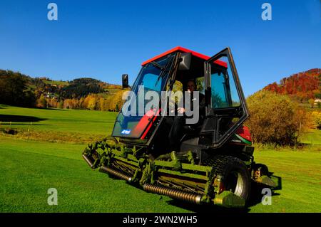 golf course superintendent or greenkeeper working on the green lawn golf course superintendent or greenkeeper Stock Photo