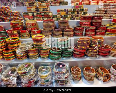 Indian colorful bangles displayed in local shop in a market of Pune, India, These beautiful bangles are made of Glass used as beauty accessories by In Stock Photo