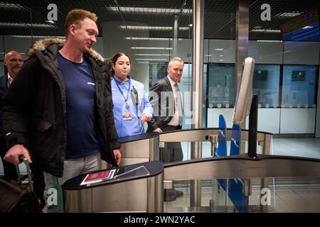 SCHIPHOL - Passengers go through check-in gates at Schiphol Airport ...
