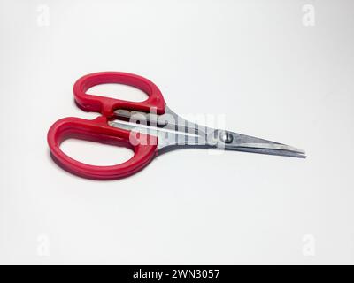 A closeup shot of old scissors on white surface Stock Photo