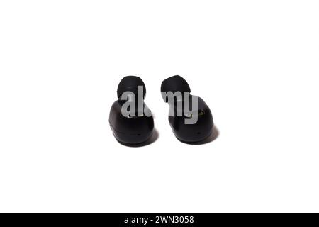 The two black earbuds on a white surface Stock Photo