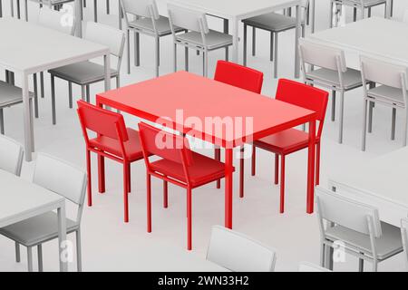 Unique red table and chairs among other grey ones in the restaurant Stock Photo