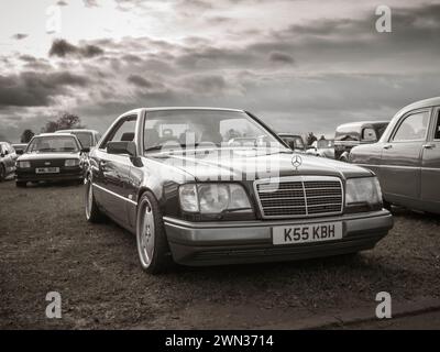 Black and white shot of a 1995 Black Mercedes-Benz on display at the Feb 2024 Banbury Car & Bike Meet in Bodicote. Stock Photo