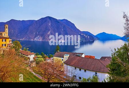 The roofs and gardens of Castagnola against blue Lake Lugano and Monte Sighignola, Ticino, Switzerland Stock Photo