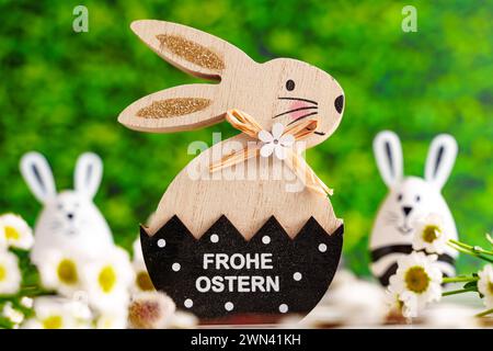 Augsburg, Bavaria, Germany - February 28, 2024: Happy Easter Greeting on an Easter bunny *** Frohe Ostern Gruß auf einem Osterhase Stock Photo