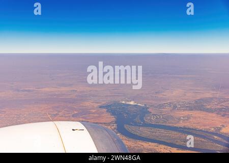 Victoria falls in Zimbabwe seen form the window of a plane. Victoria falls Zimbabwe, Africa seen form the window of a plane. Travel concept. Copy-spac Stock Photo