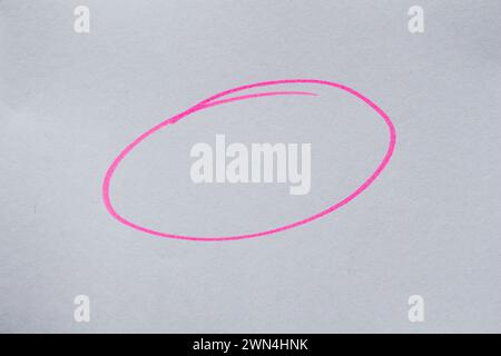 Hand drawn pink doodle on white paper. Circle shape. Stock Photo