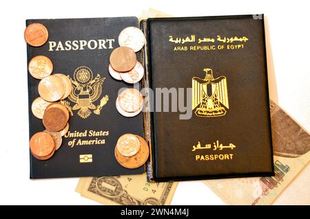 Egyptian passport, Egypt's money banknotes pounds, American passport, USD dollars and coins change, United States of America Traveler ID and Arab Repu Stock Photo