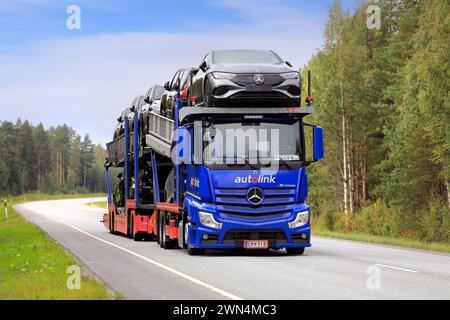 Blue Mercedes-Benz Actros vehicle carrier truck Autolink transports new Mercedes-Benz cars on highway 25. Raasepori, Finland. September 8, 2023. Stock Photo