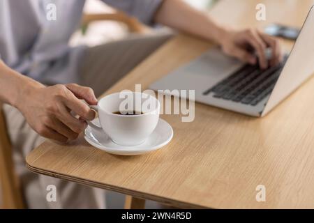 Young man enjoying coffee in café Stock Photo