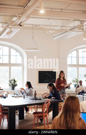 Business colleagues working together at coworking office Stock Photo