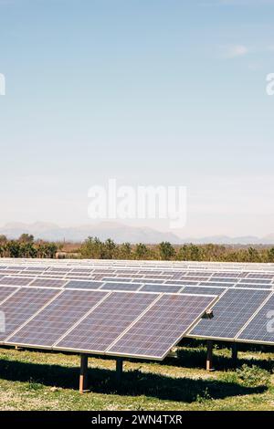 Rows of solar panels in a field. Solar power plant. with solar panels ...