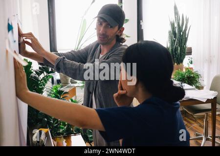 Multiracial architect colleagues discussing at home office Stock Photo