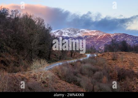 A snow covered Ben Ledi from the Duke’s Pass through the Queen Elizabeth Forest near Aberfoyle, Trossachs, Stirling, Scotland Stock Photo