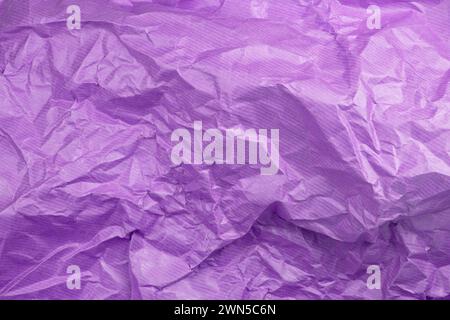 Сrumpled paper texture purple. Texture of crumpled paper. Crumpled paper. Wrinkles paper. Stock Photo