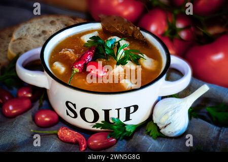hearty homemade soup in a  bowl on the table Stock Photo