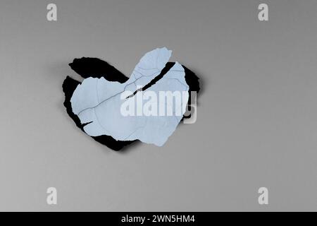 Stil life damage two grey and black heart paper on background for multiple concept and inspiration of motivate Stock Photo