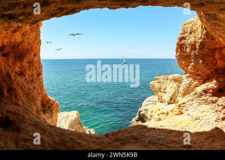 View to coastline with caves at Benagil near beautiful portuguese beach Praia de Carvoeiro near Lagoa in summer, Algarve Portugal Stock Photo