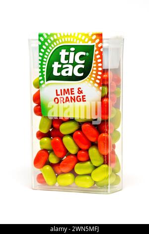 Close up of an unopened pack of orange and lime Tic Tac or Tic Tacs, isolated against a white background Stock Photo
