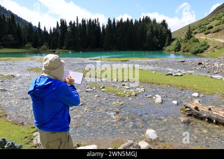 August 31 2023 - Semyonovka, Kyrchyn Valley in Kyrgyzstan: People enjoy the nature in the north of Kyrgyzstan mountains Stock Photo