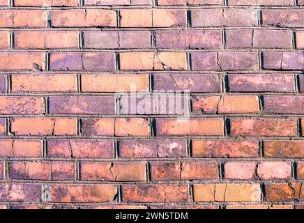old brick wall background. Brickwork or stonework interior concrete grid uneven bricks design stack. orange brick wall background.Pattern of red brick Stock Photo