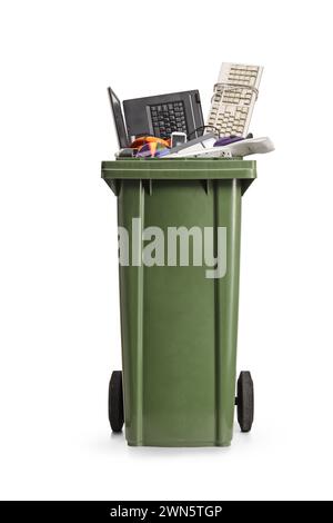 Waste bin with old electronic devices, laptop, computer keyboard, mobile phone isolated on white background, e-waste concept Stock Photo