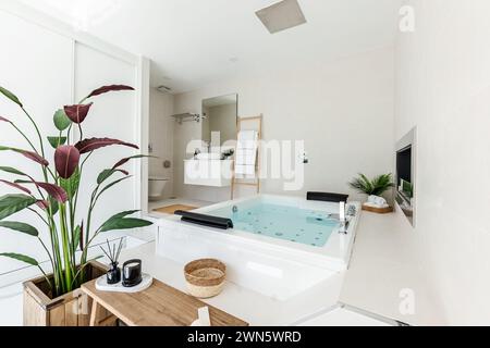 an image of a private double jacuzzi with overhead shower and fireplace in luxury mediterranean villa Stock Photo
