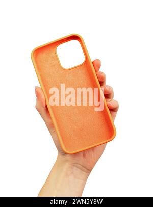 Hand holding plastic phone case, isolated on white. Stock Photo