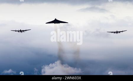 21/08/14  Two Avro Lancasters and an Avro Vulcan fly over a turf cutting ceremony where the International Bomber Command Centre will be begin construc Stock Photo