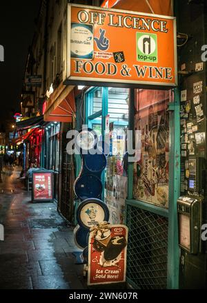 London local shopping at night off licence Stock Photo