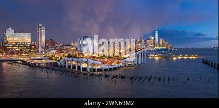 New York City, Little Island public park at twilight with view of the World Trade Center after a storm. West Village, Manhattan Stock Photo