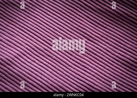 Purple knit close-up, ribbed, distinct texture. Abstract background. Stock Photo