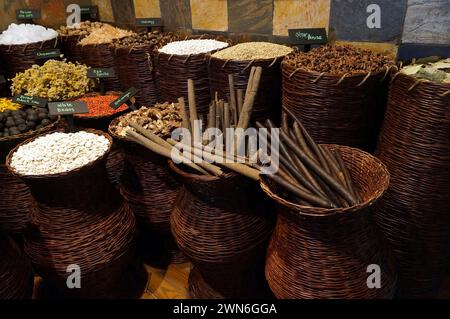 Variety of spices and dried herbs flowers on the arab street market stall. Dubai Spice Souk in Deira, United Arab Emirates. Stock Photo