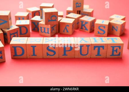 Cubes with word Dispute on color background Stock Photo