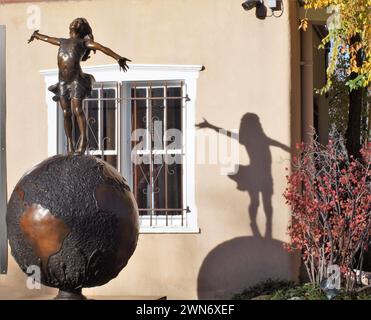 Statue and girls shadow at a gallery window Stock Photo