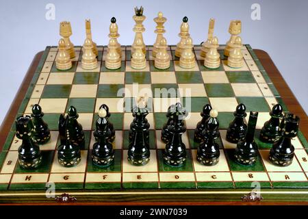 Chess board on the round white table. View with chess pieces on a chess table in contes Stock Photo